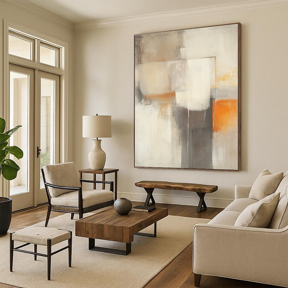Large abstract painting in beige and grey tones featuring blurred geometric shapes and a subtle orange accent for vibrancy.STSC753