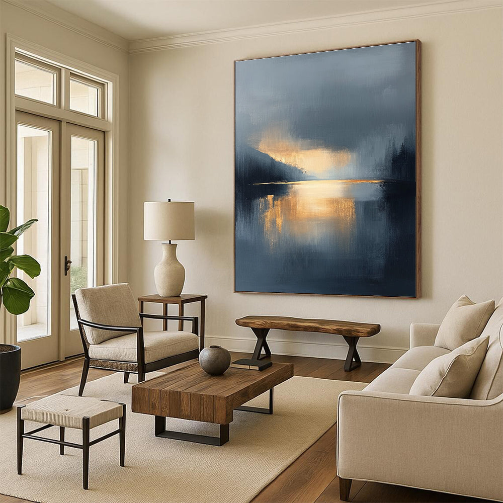 Large abstract oil painting featuring a lake and sky with navy blue and gold tones atmospheric clouds and reflections in calm waters.STSC167