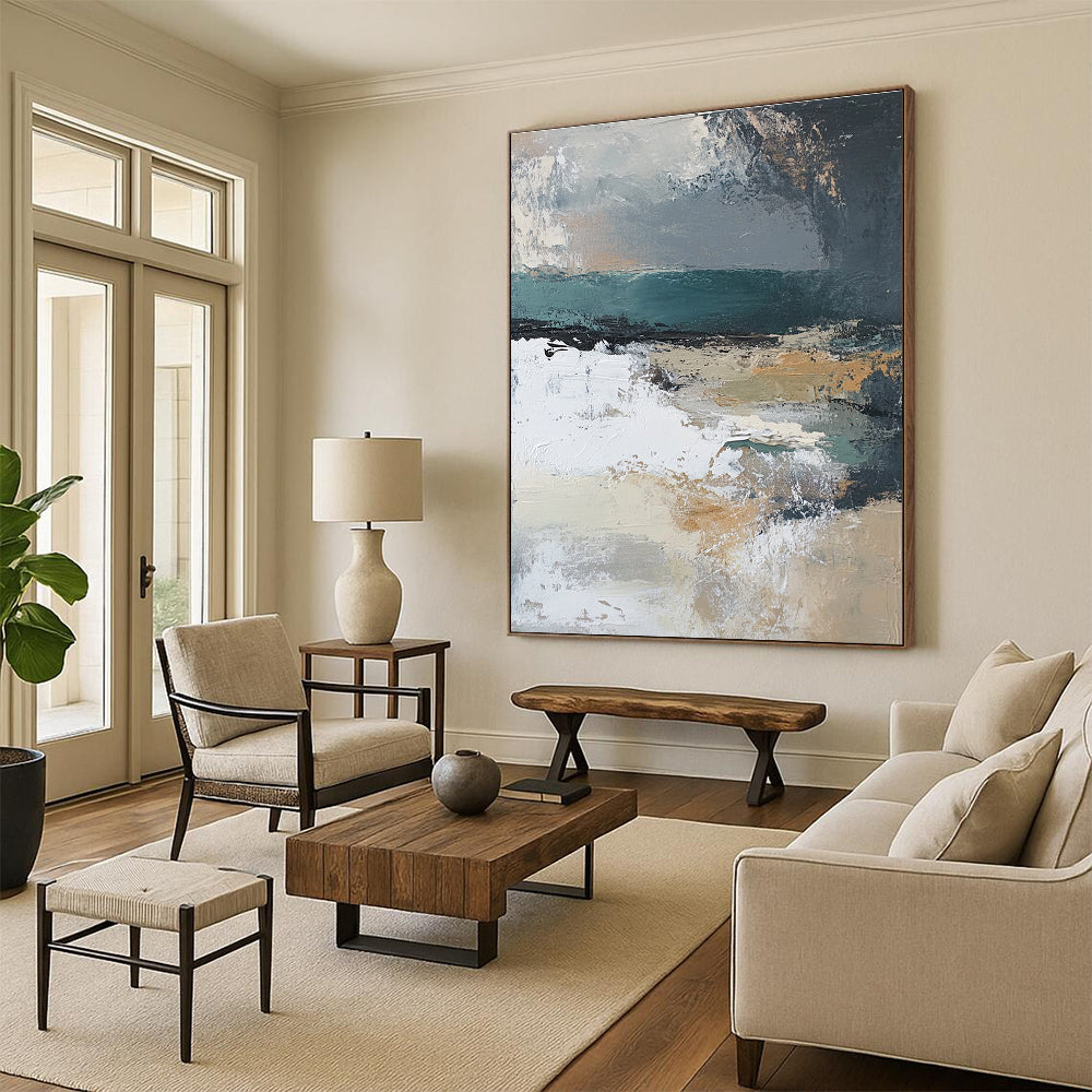Large abstract painting featuring muted beige grey teal silver and green hues with white abstract shapes and textured layers depicting a serene landscape.STSC380