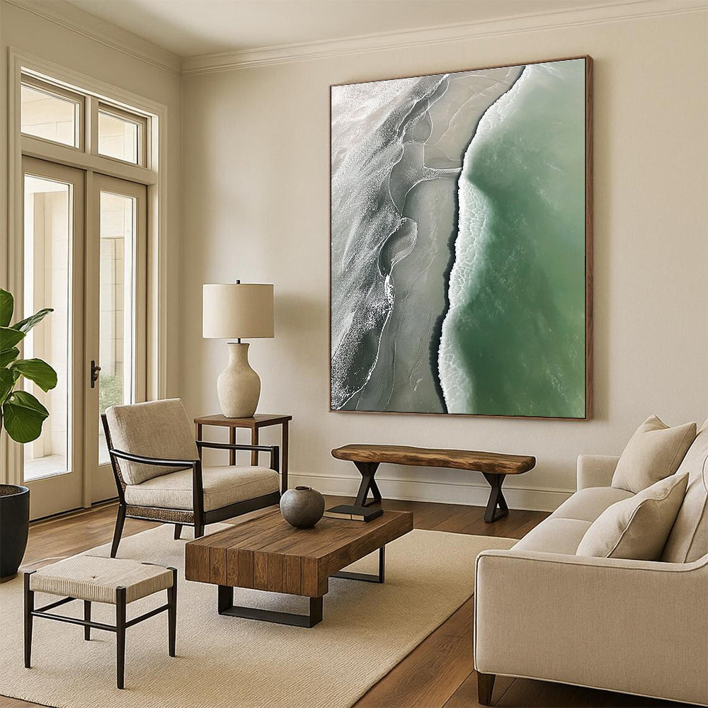 Abstract art piece featuring an aerial view of a beach with green and gray waves flowing onto white sandy shores.STSC529