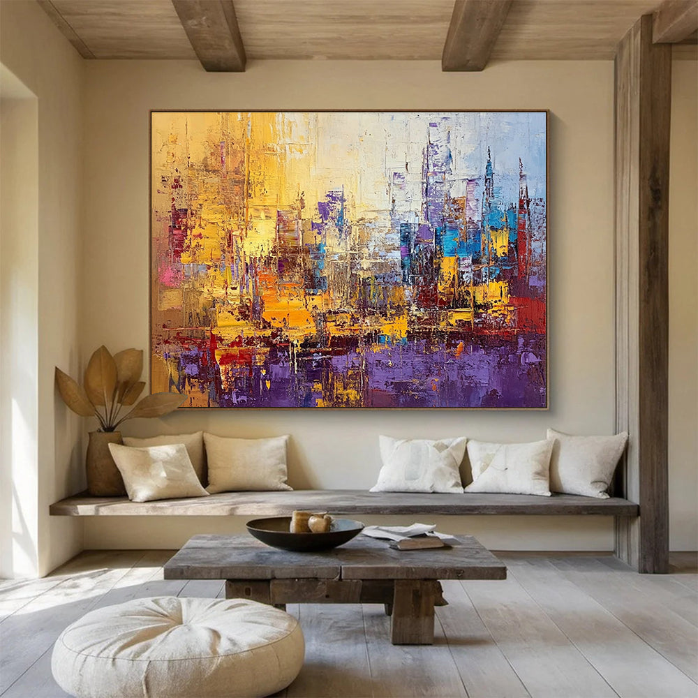 Large abstract painting of a vibrant cityscape in textured gold blue purple and red with impasto strokes and palette knife techniques.SC355