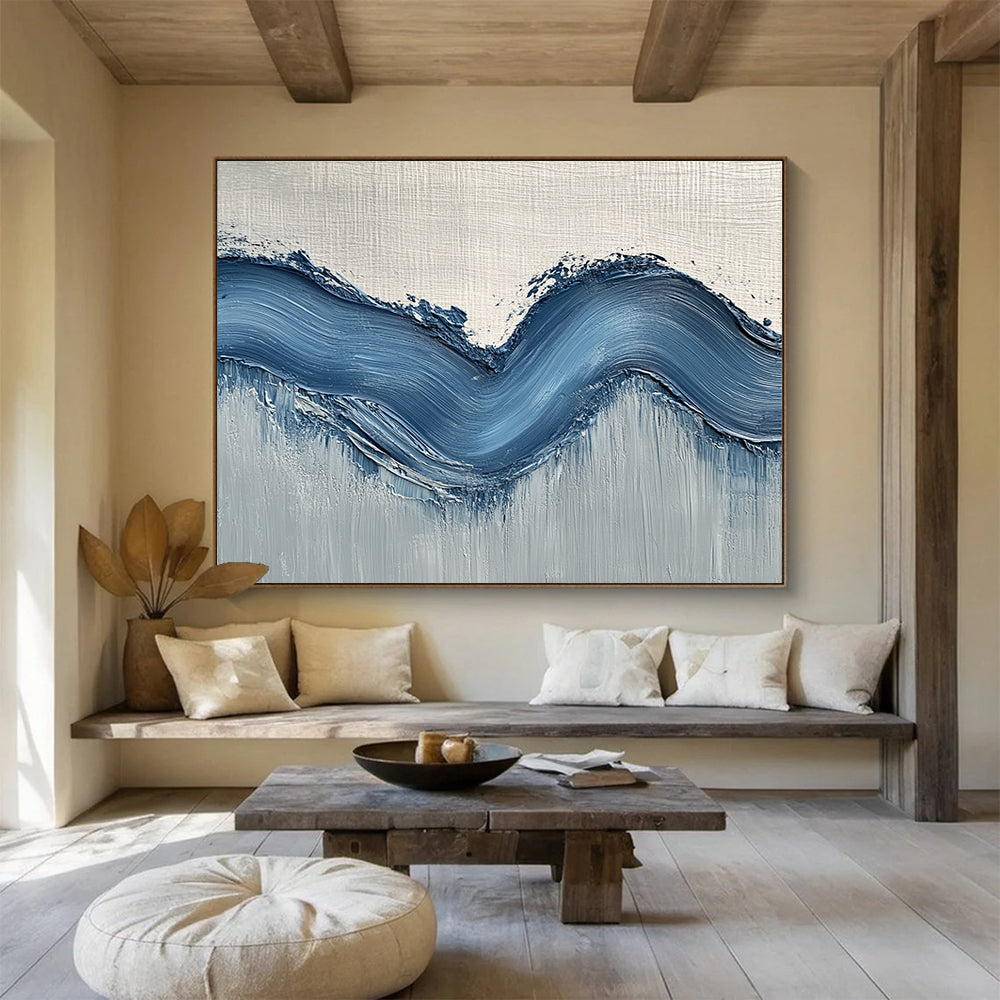 Large abstract painting with gentle blue hills on light gray wall, showcasing depth and movement for a modern aesthetic.SC453