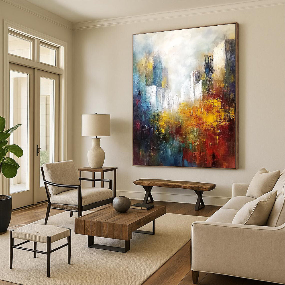 Large abstract landscape painting featuring white buildings in the distance with soft edges and muted tones in a light sky blue and dark amber palette.STSC106