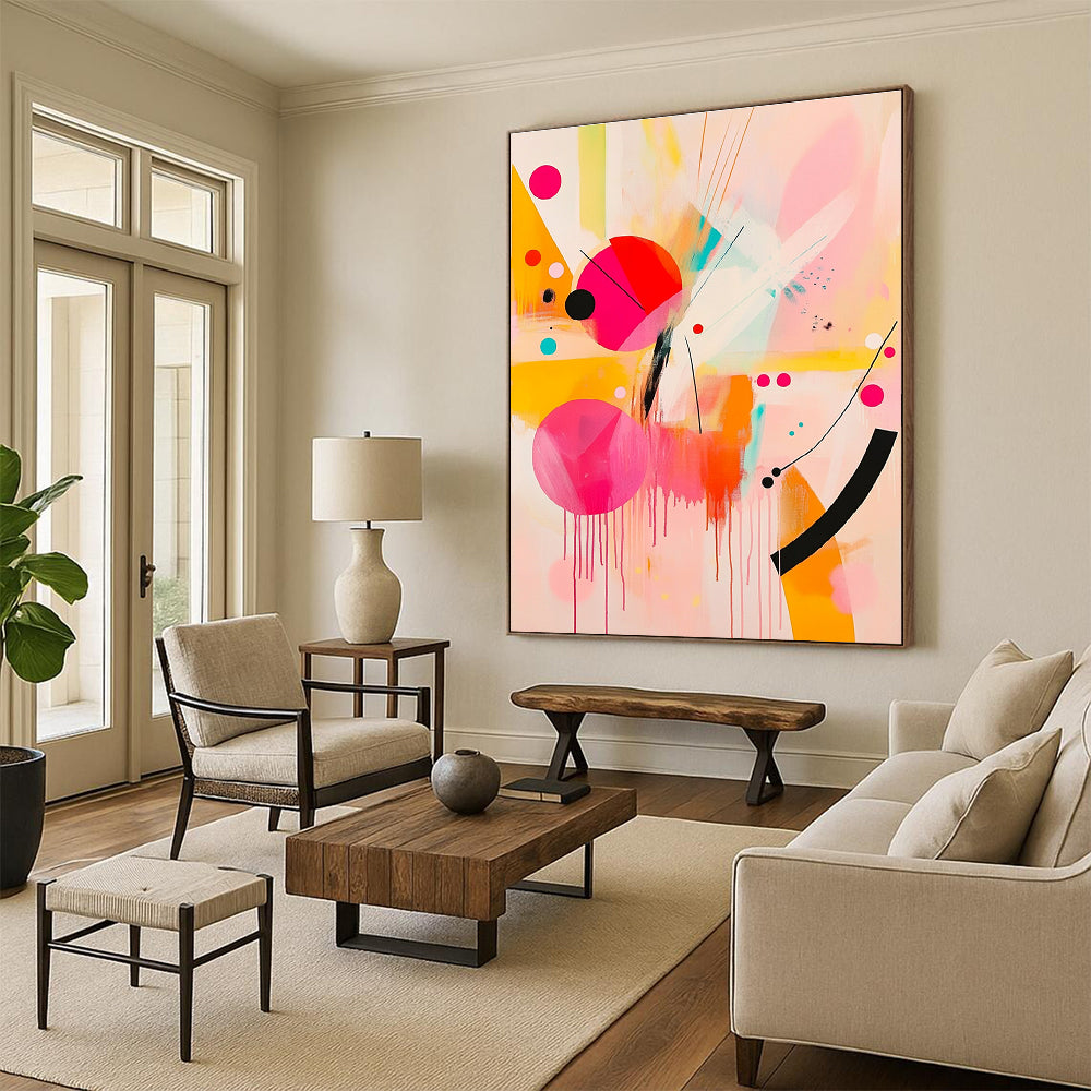 Large abstract painting featuring pink and yellow shapes with black lines and bright orange geometric forms creating a joyful playful composition.STSC790