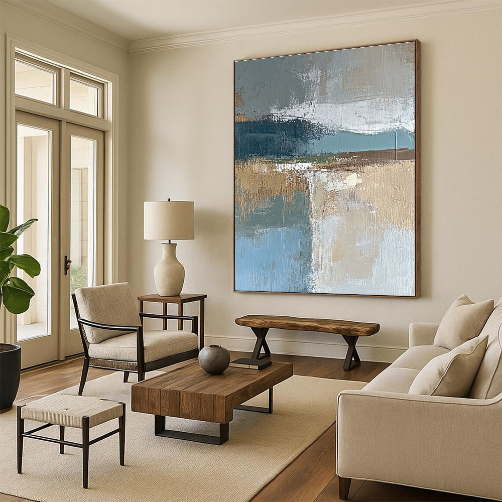 Large abstract painting featuring muted blue gray and brown tones with textured brushstrokes and earthy accents in green and beige.STSC563
