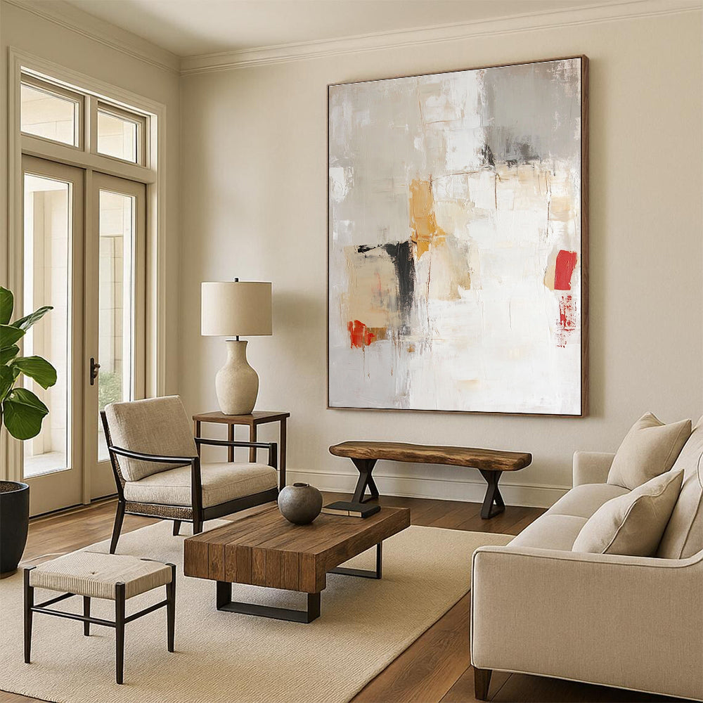 Large abstract painting in soft neutral tones of beige and white with expressive brushstrokes and hints of red and yellow.STSC801