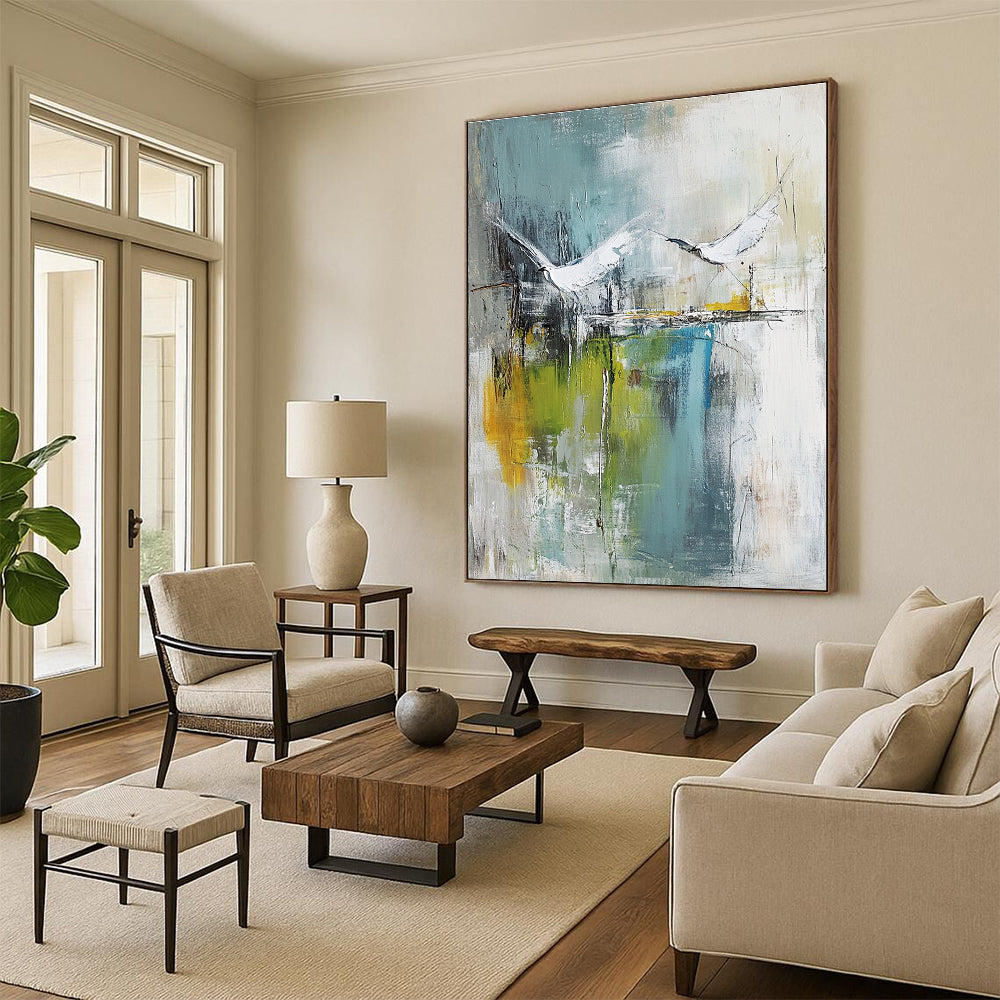 Large abstract painting of birds soaring over water in pale green and white with hints of blue beige and gray in a mixed media style.STSC303