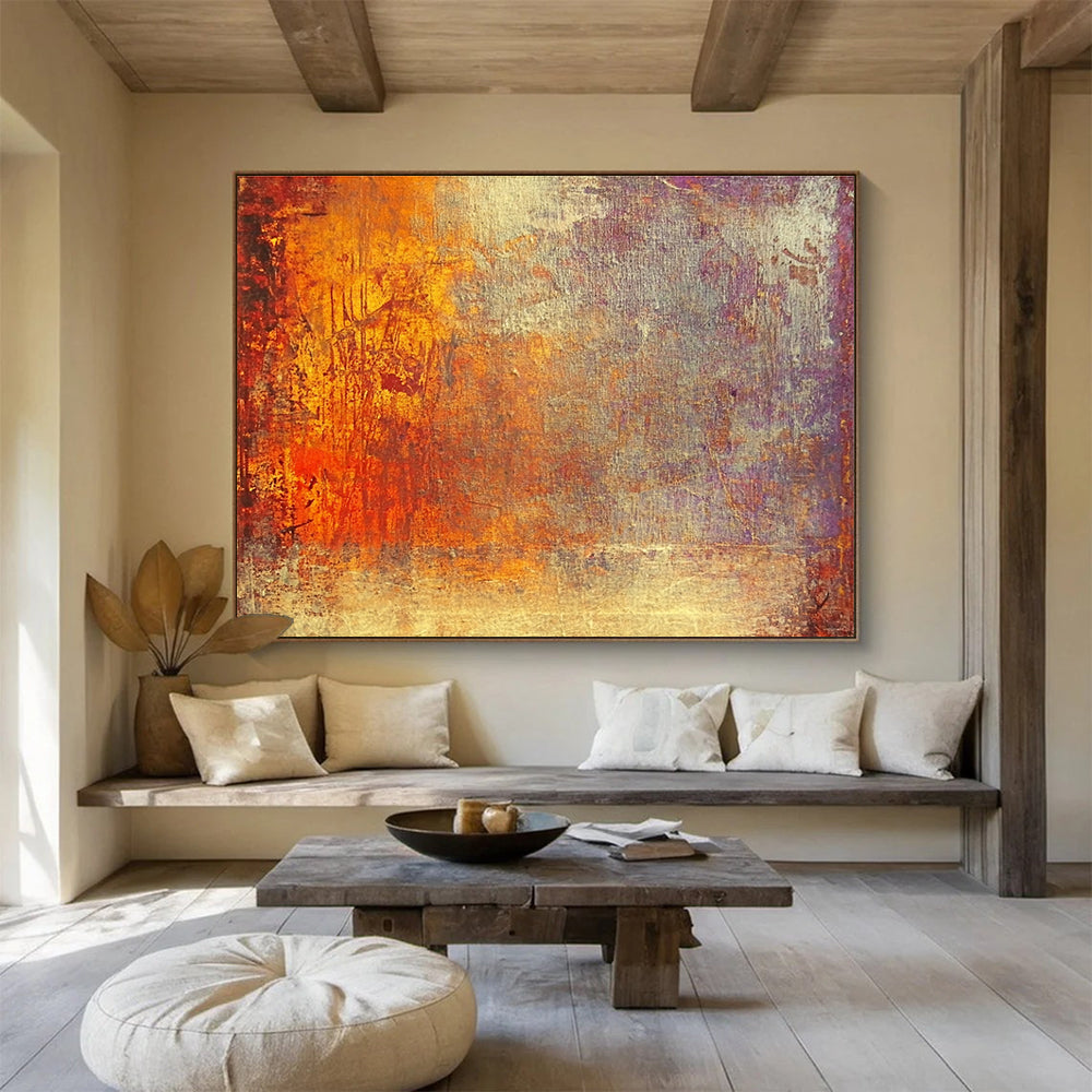 A large abstract painting featuring warm tones of gold reds and oranges evokes autumn's energy and symbolizes life's transitions with a golden sunset backdrop.SC432