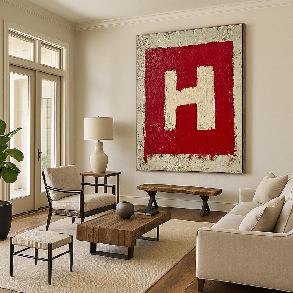 A large abstract painting featuring a minimalistic red and white letter H on textured canvas, showcasing simple brush strokes in oil paint.STSC1163
