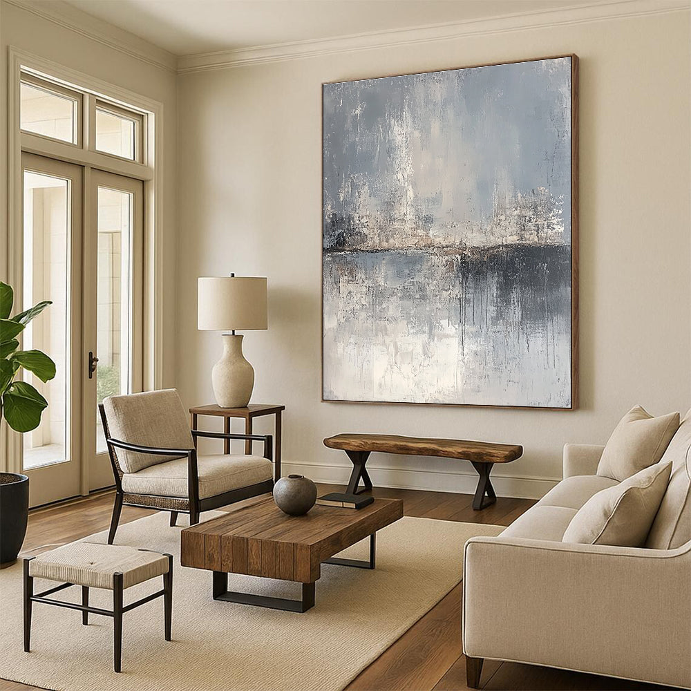 Large abstract painting depicting a serene landscape in gray and beige tones, featuring canvas texture and an atmospheric quality.STSC063