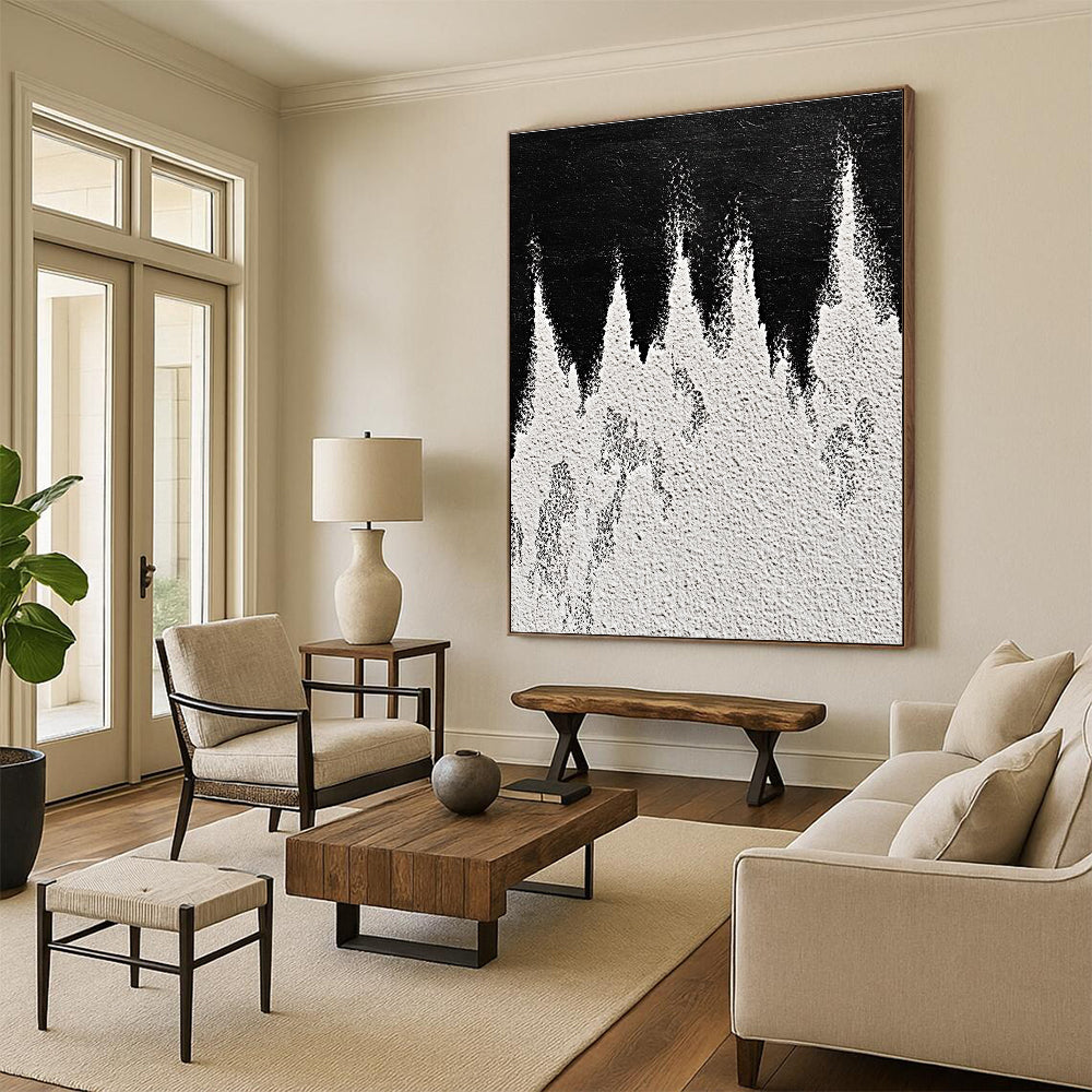 A large abstract painting featuring white powder on a black background with textured mountain ranges in playful gray and white tones capturing sharp edges.STSC1487