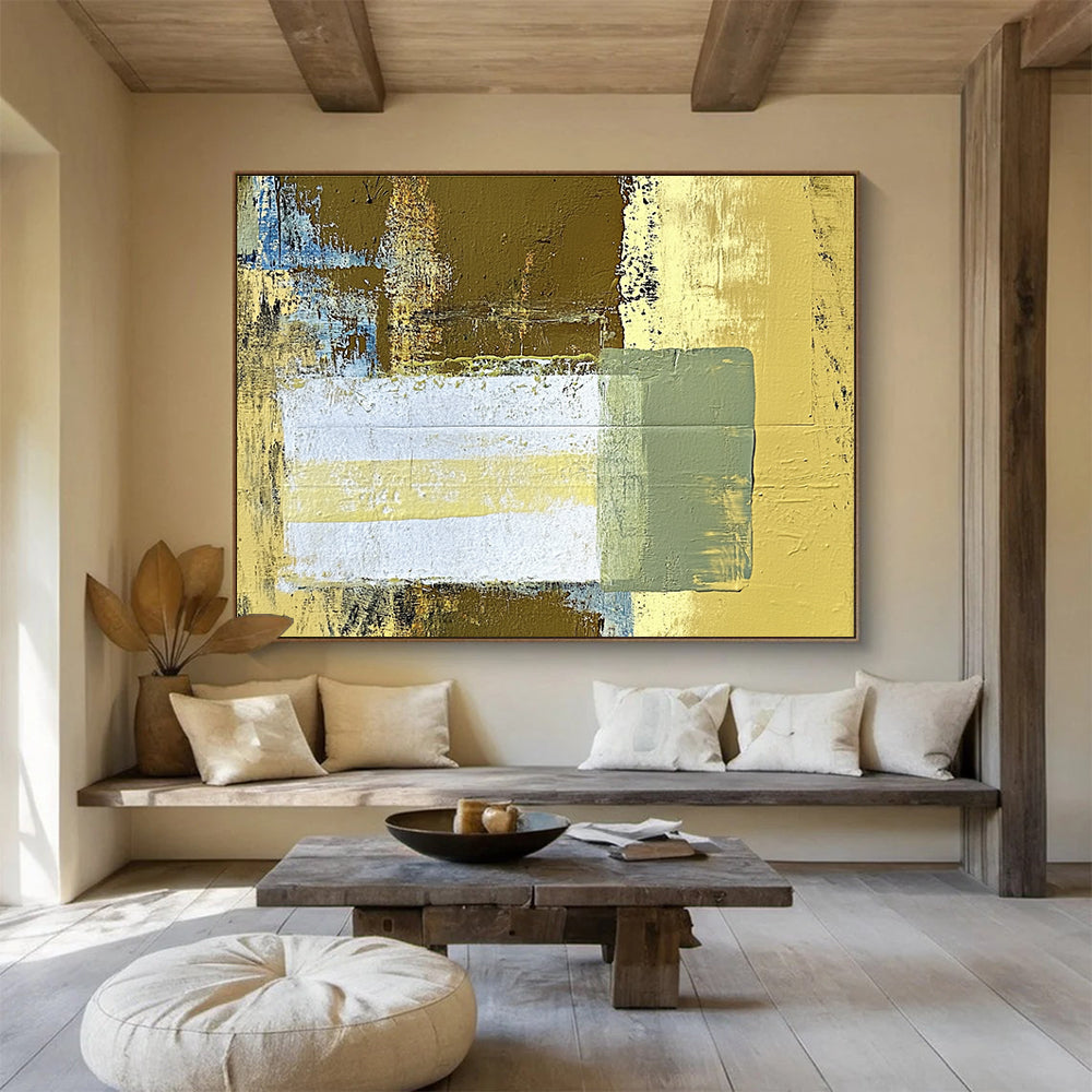 Large abstract painting featuring beige and yellow tones with a central white rectangle and green stripe against a dark brown background.SC425