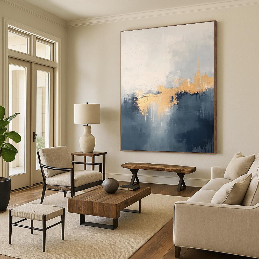 Large abstract painting in grey and blue tones with gold accents creating a dreamy misty atmosphere.STSC731