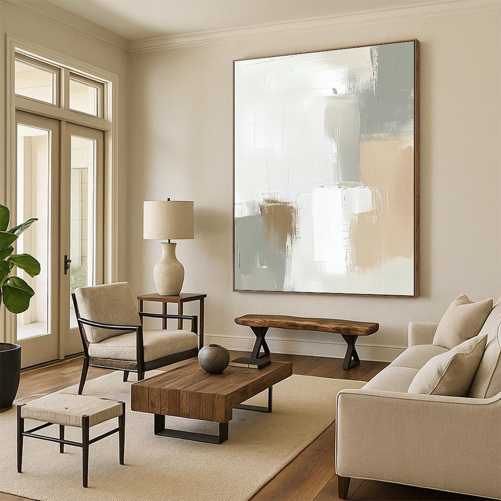 Large abstract painting in soft tones of white and beige featuring soft strokes and neutral shapes that blend harmoniously.STSC379