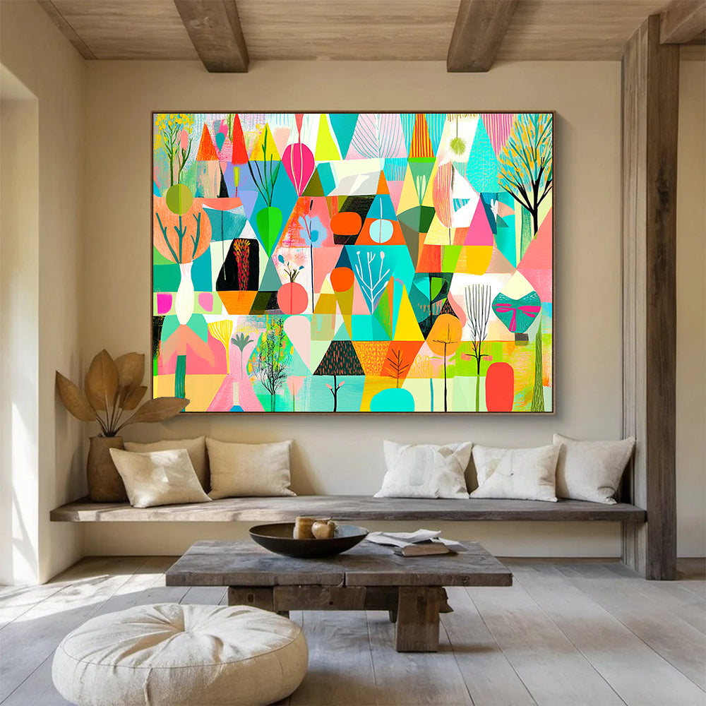 A large abstract painting featuring vibrant geometric shapes in shades of green pink blue yellow and orange with floral elements and nature motifs.SC563