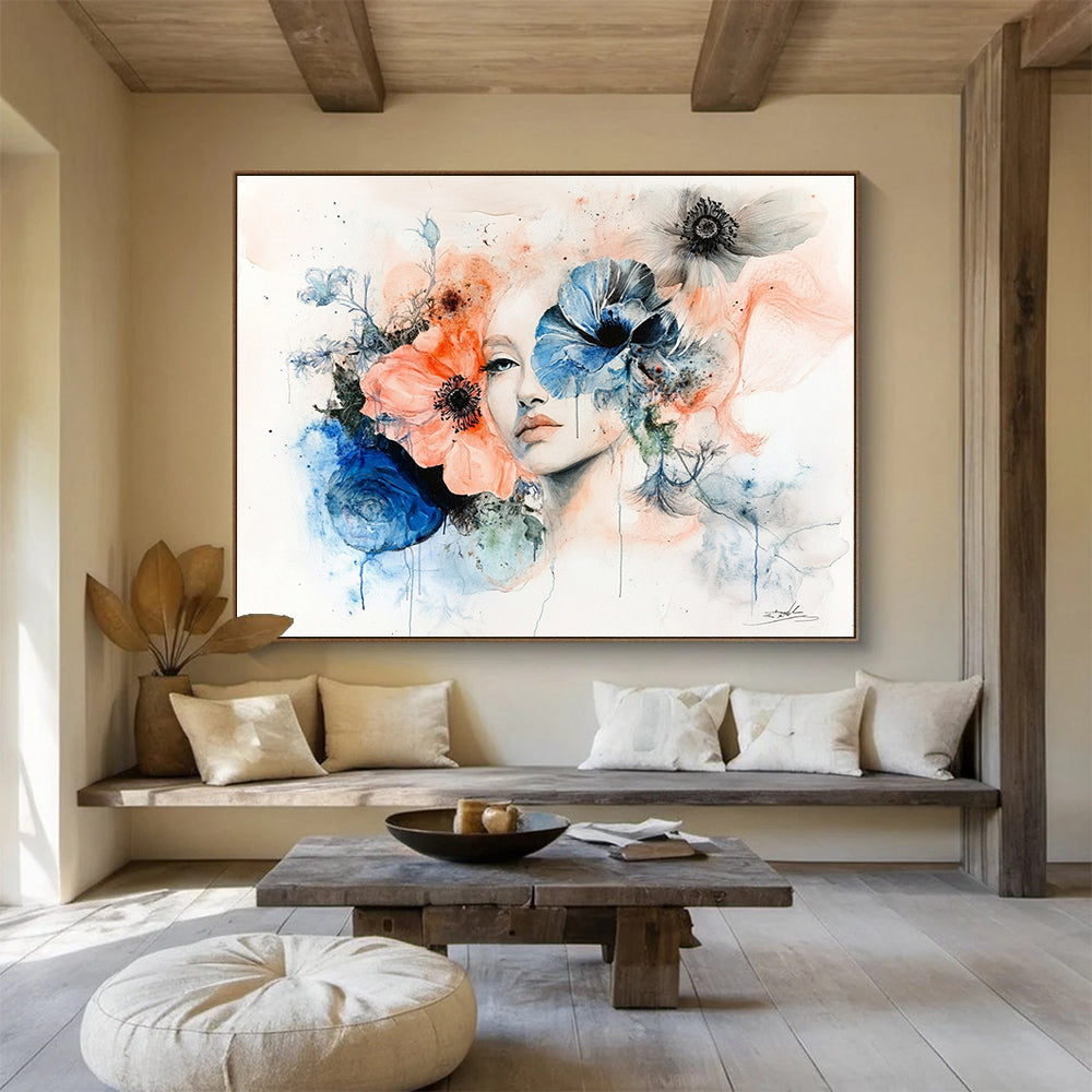 Large abstract painting featuring a woman's face framed by flowers in muted pastels of peach pink blue and grey on a white background.SC566