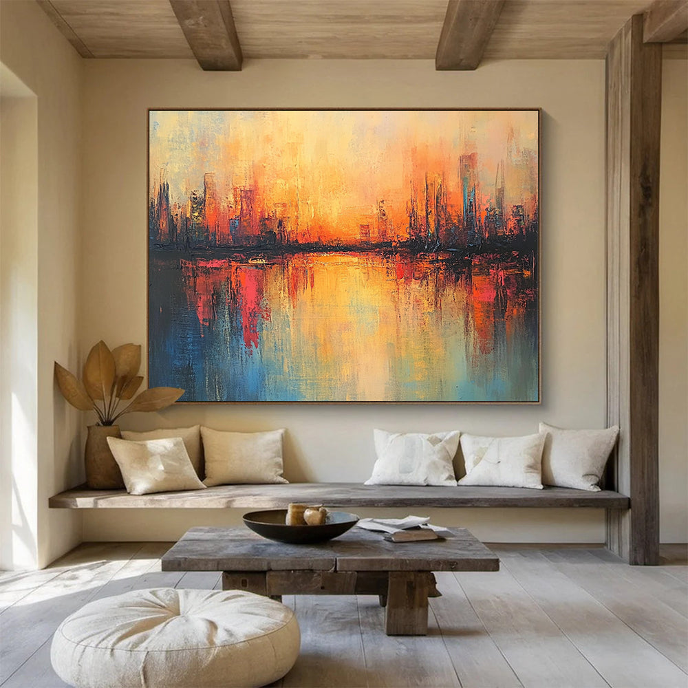 Large abstract painting featuring a cityscape in warm hues with soft brush strokes and reflections on calm waters, evoking a serene sunrise atmosphere.SC037