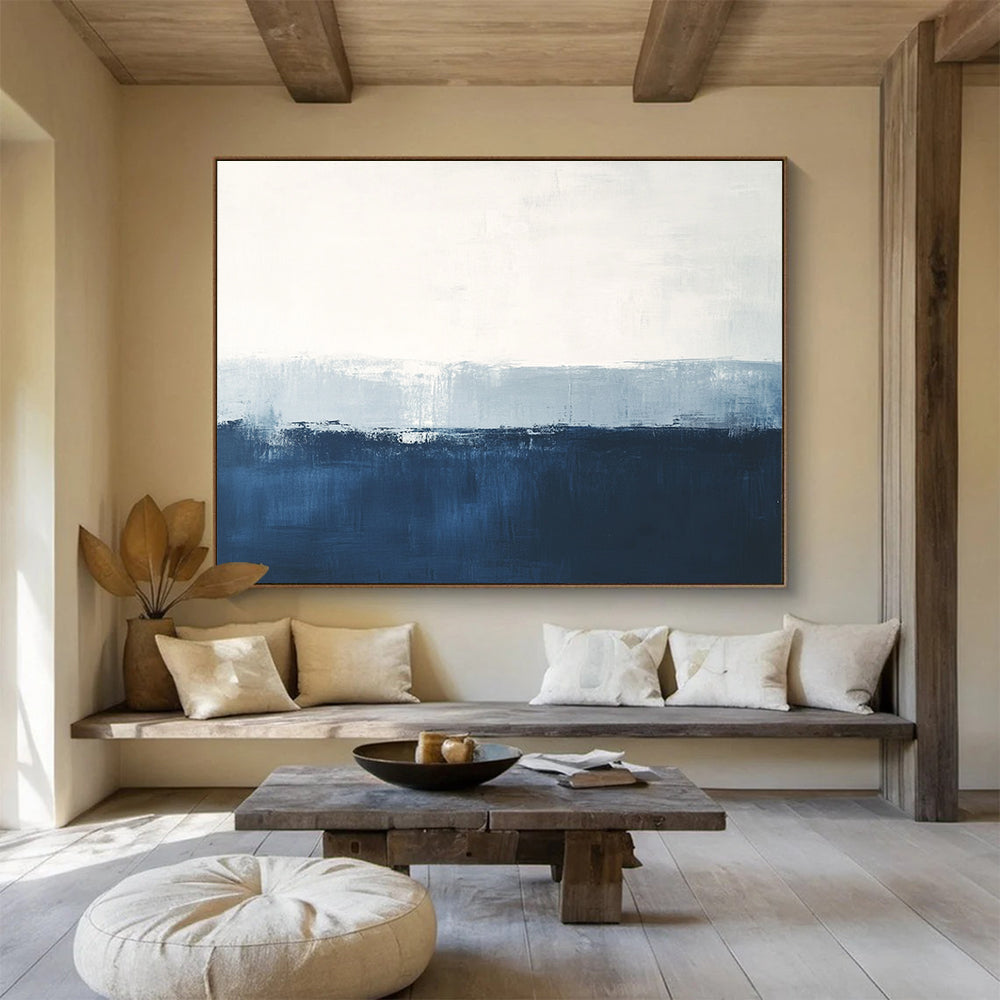 Large abstract painting in calming blue and white with subtle textures tranquil sea view soft edges and atmospheric skies.SC027