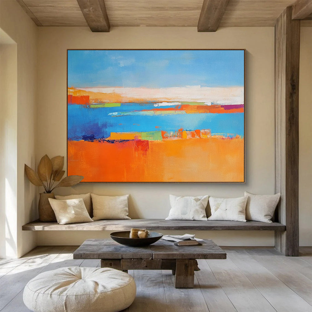 Large abstract painting featuring a soft blue background vibrant oranges geometric patterns warm yellows with green shapes and white figures symbolizing nature.SC060