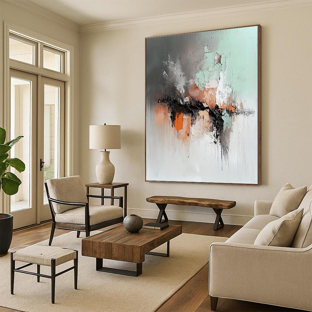 Large abstract painting featuring soft gray mint green and rust orange with a dark brown lava flow and a blurred silhouette walking away.STSC795