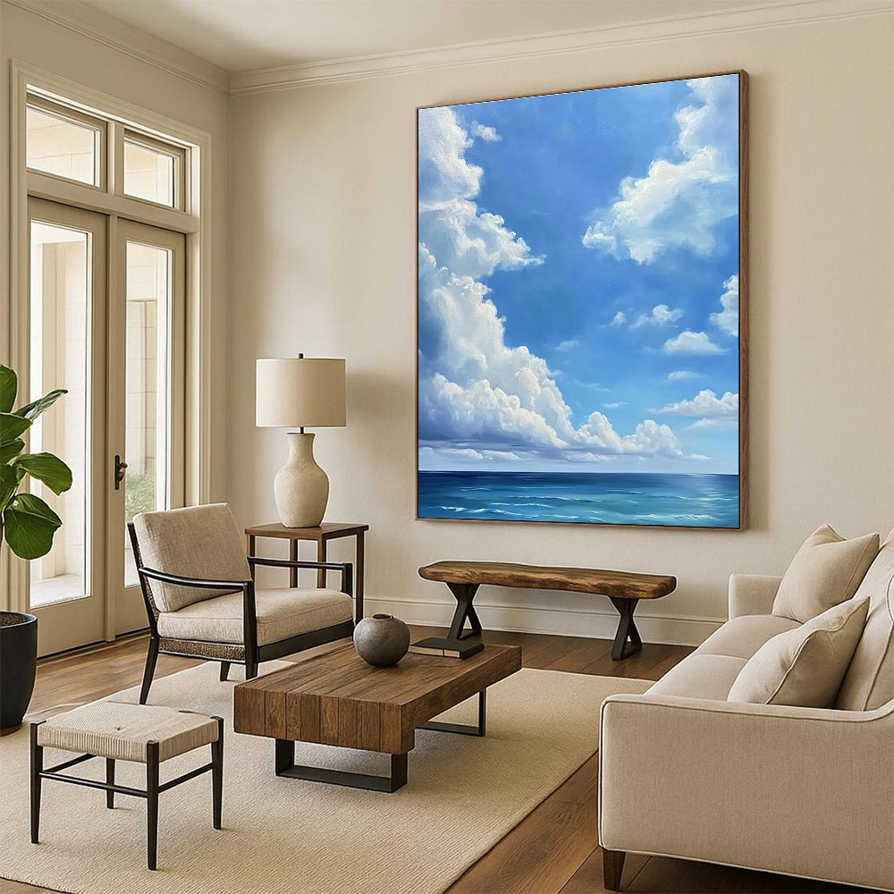 A large abstract painting featuring a blue sky with white clouds and a vast ocean below in a minimalist oil painting style.STSC923