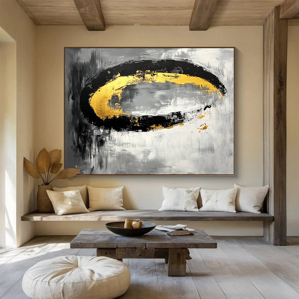 Large abstract painting featuring black white gray tones with gold accents and oval brush strokes on canvas.SC137