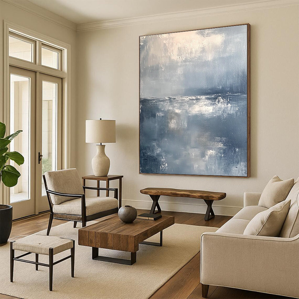 Large abstract painting of a serene ocean horizon in muted gray and white tones with soft brushstrokes conveying tranquility and elegance.STSC262