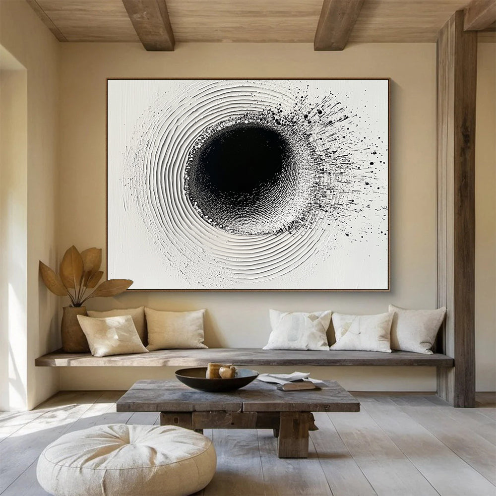 An abstract painting featuring a circular hole filled with water droplets creating ripples on a white plaster background with black ink lines.SC435