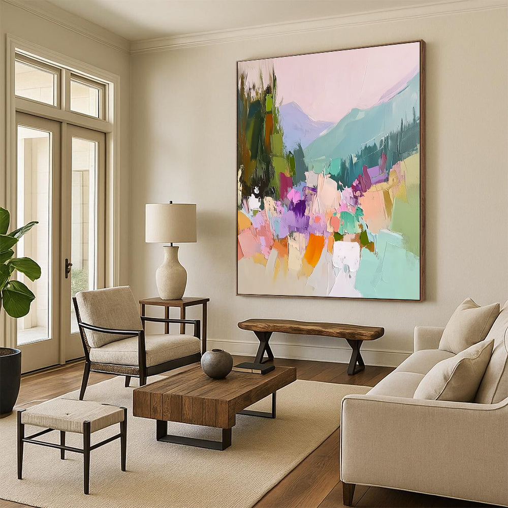 Large abstract painting featuring vibrant colors with trees flowers and mountains showcasing thick brush strokes and textured canvas in a harmonious light pink sky.STSC104