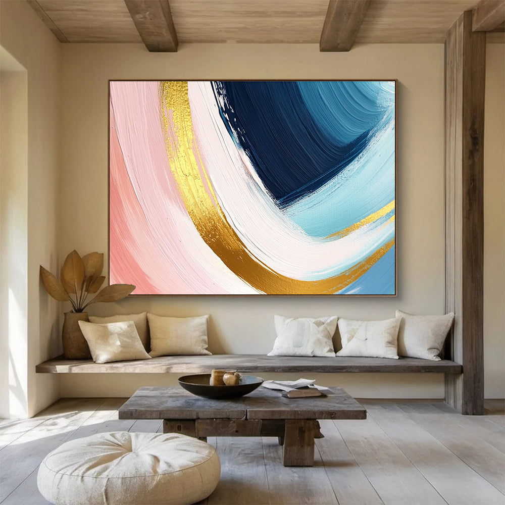 A large abstract painting in pastel pink blue and yellow with dynamic brushstrokes and gold outlines evoking joy and warmth.SC443