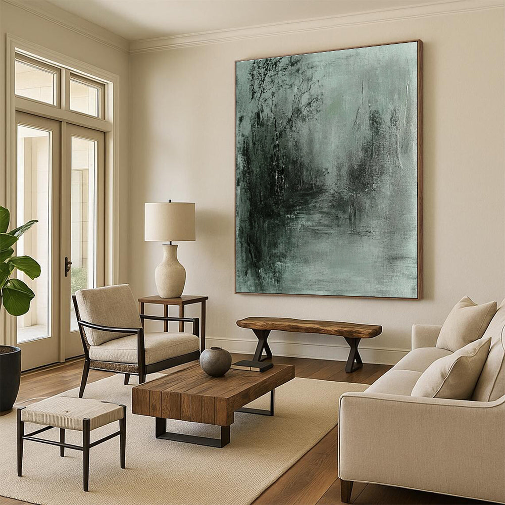 Large abstract painting in gray and green tones featuring soft edges and a dark background evokes tranquility and mystery through fluid brushstrokes.STSC419