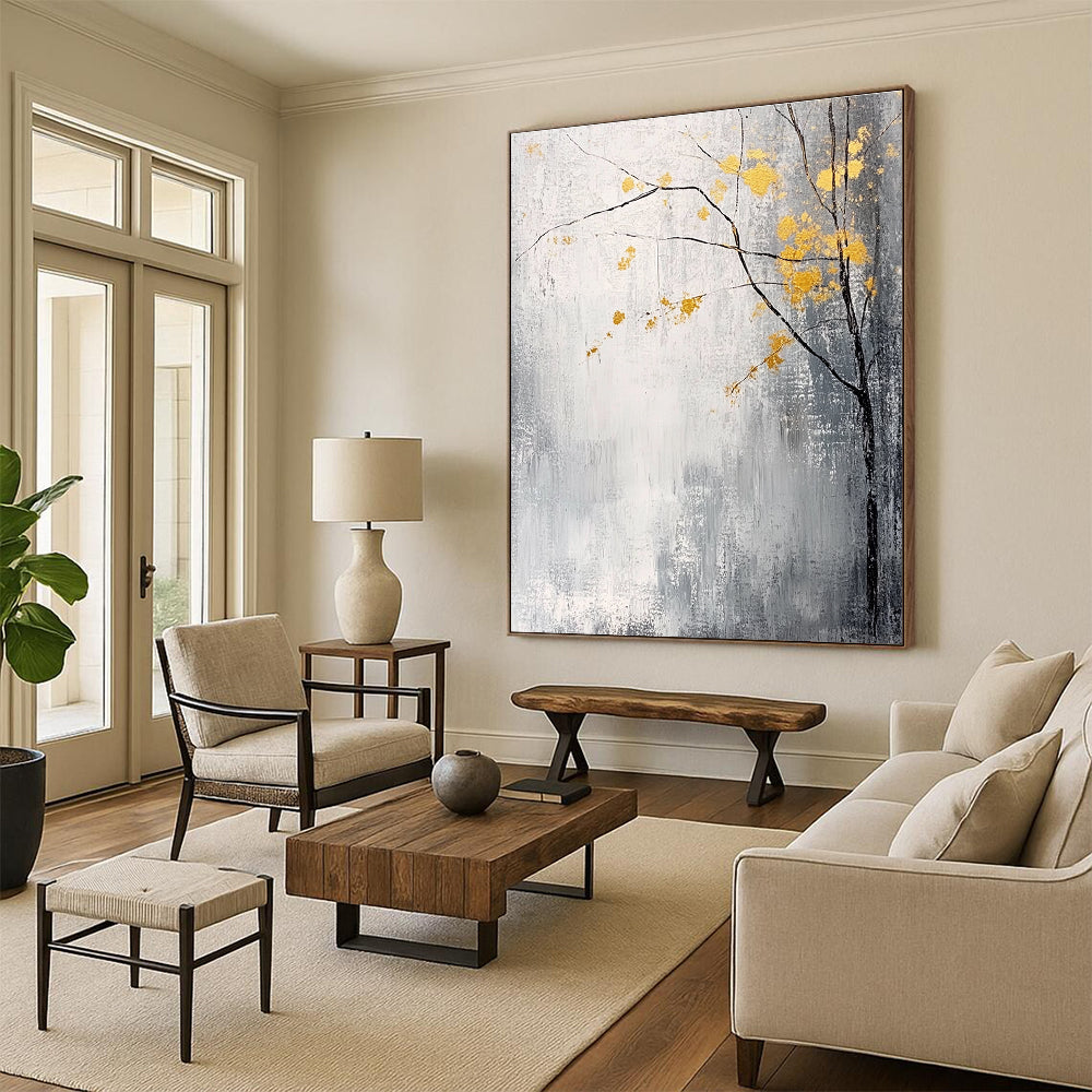 Large abstract painting with gray and white background yellow accents and delicate gold leaves creating a tranquil and mysterious atmosphere.STSC395