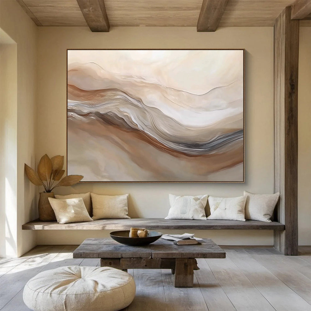 Large abstract painting featuring swirling beige and white hues resembling desert dunes capturing movement and depth in a serene landscape.SC447