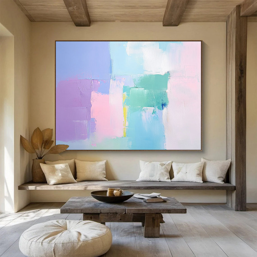 Large abstract painting with soft pastel colors thick brush strokes and a minimalist impressionist style featuring pink blue and light green tones.SC255