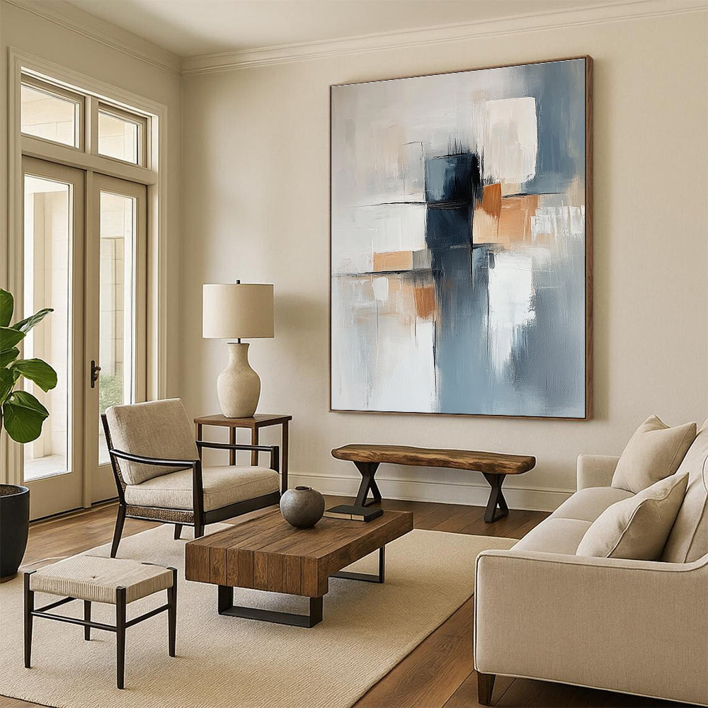 Large abstract painting featuring a light blue and gray background with soft lines and elegant white shapes complemented by dark blocks and warm accents.STSC400