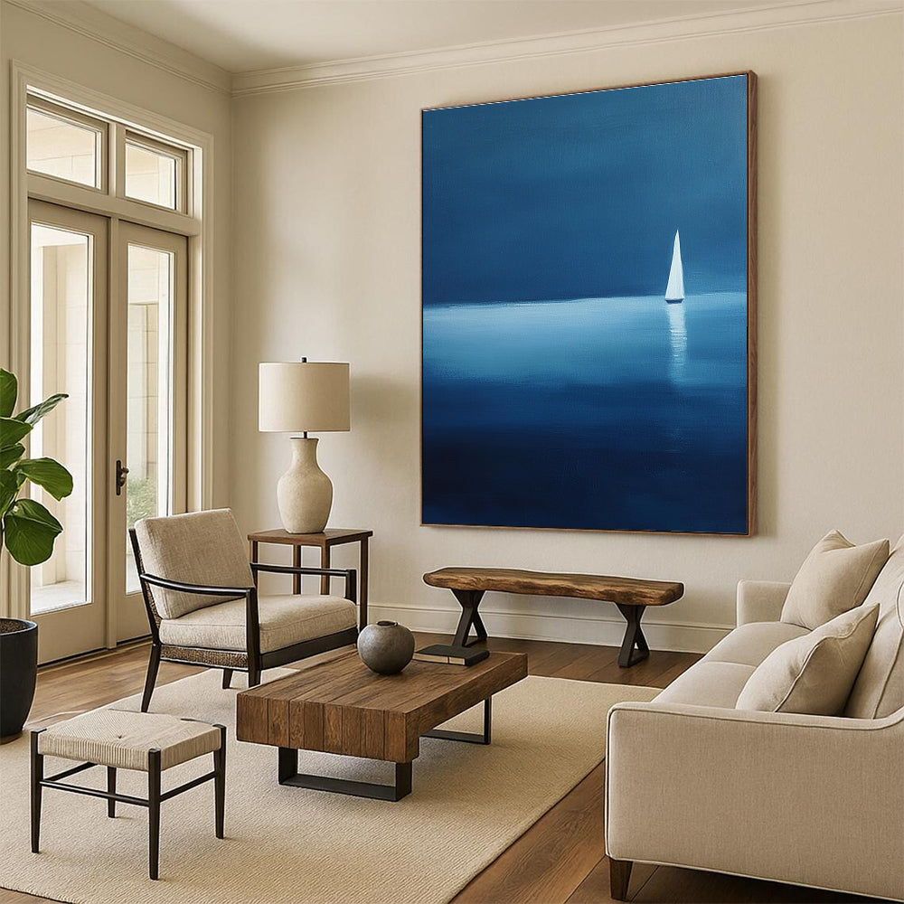 Large abstract painting of a serene sailboat on calm waters using blue and white shades against a dark backdrop evoking tranquility and solitude.STSC1086