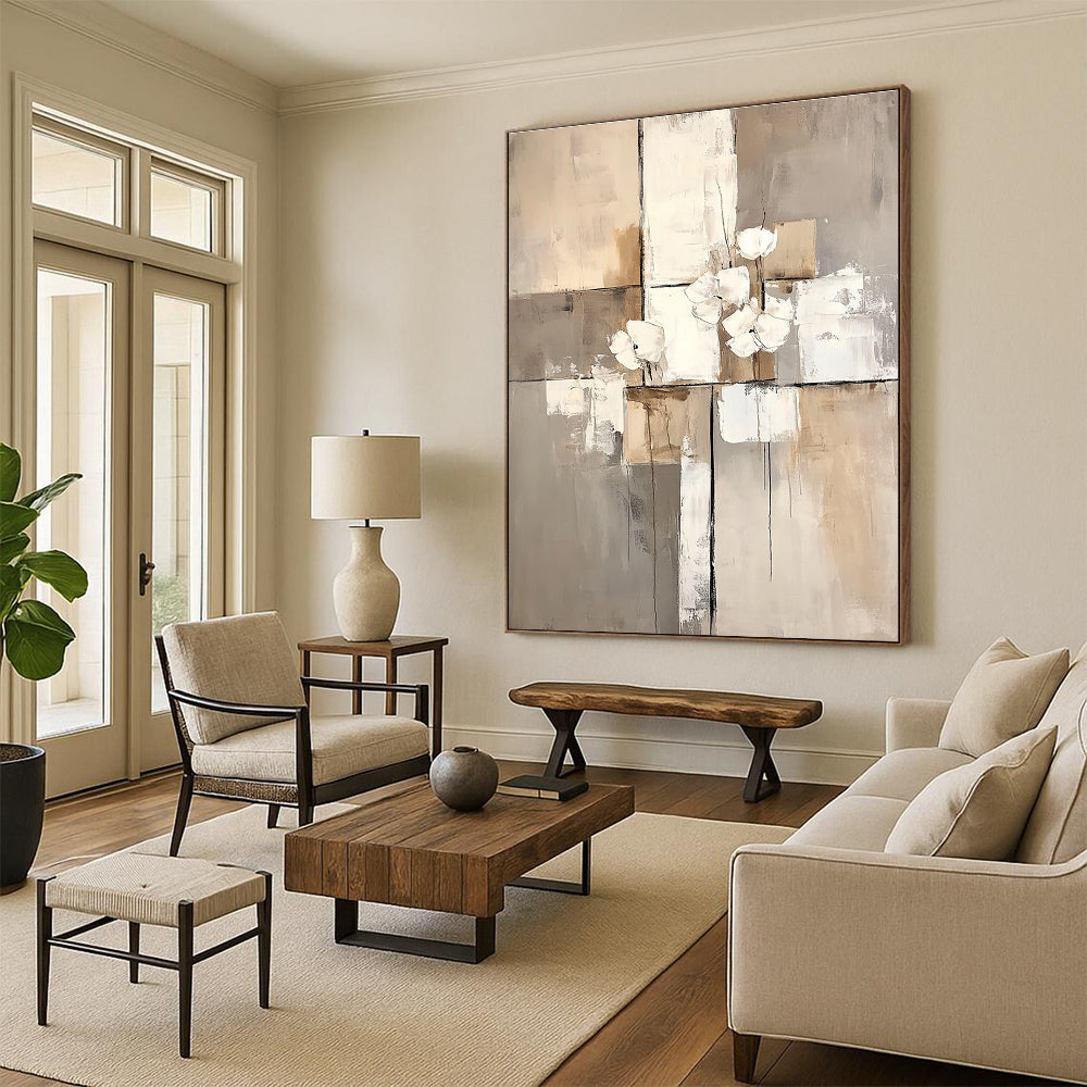 Large abstract painting featuring white paint blocks with a beige and gray palette on a neutral beige background.STSC431
