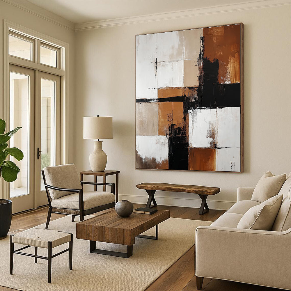 Abstract painting featuring brown and white color blocks with minimalistic black shapes enhancing each section creating a striking visual impact.STSC415