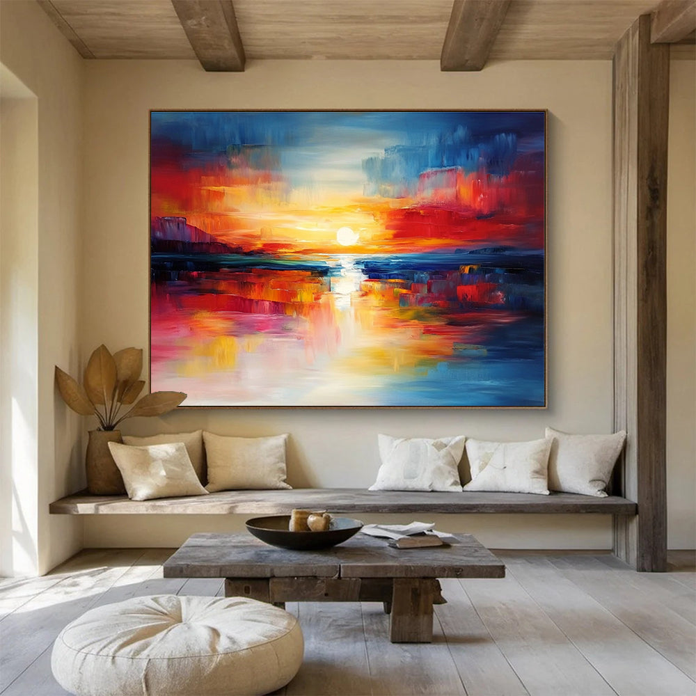 A large abstract painting capturing a vibrant sunset with blue and red hues reflecting on calm waters, creating a dynamic central composition.SC561