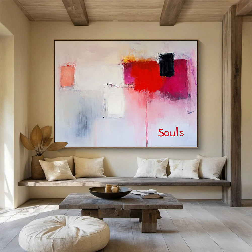 Large abstract painting in soft pinks and whites with red hints features expressive brushstrokes and the word Souls in a minimalist style.SC139