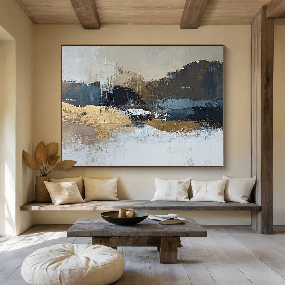 Large abstract painting in beige and dark blue tones with gold accents showcasing a minimalist winter landscape in a neutral color palette.SC226