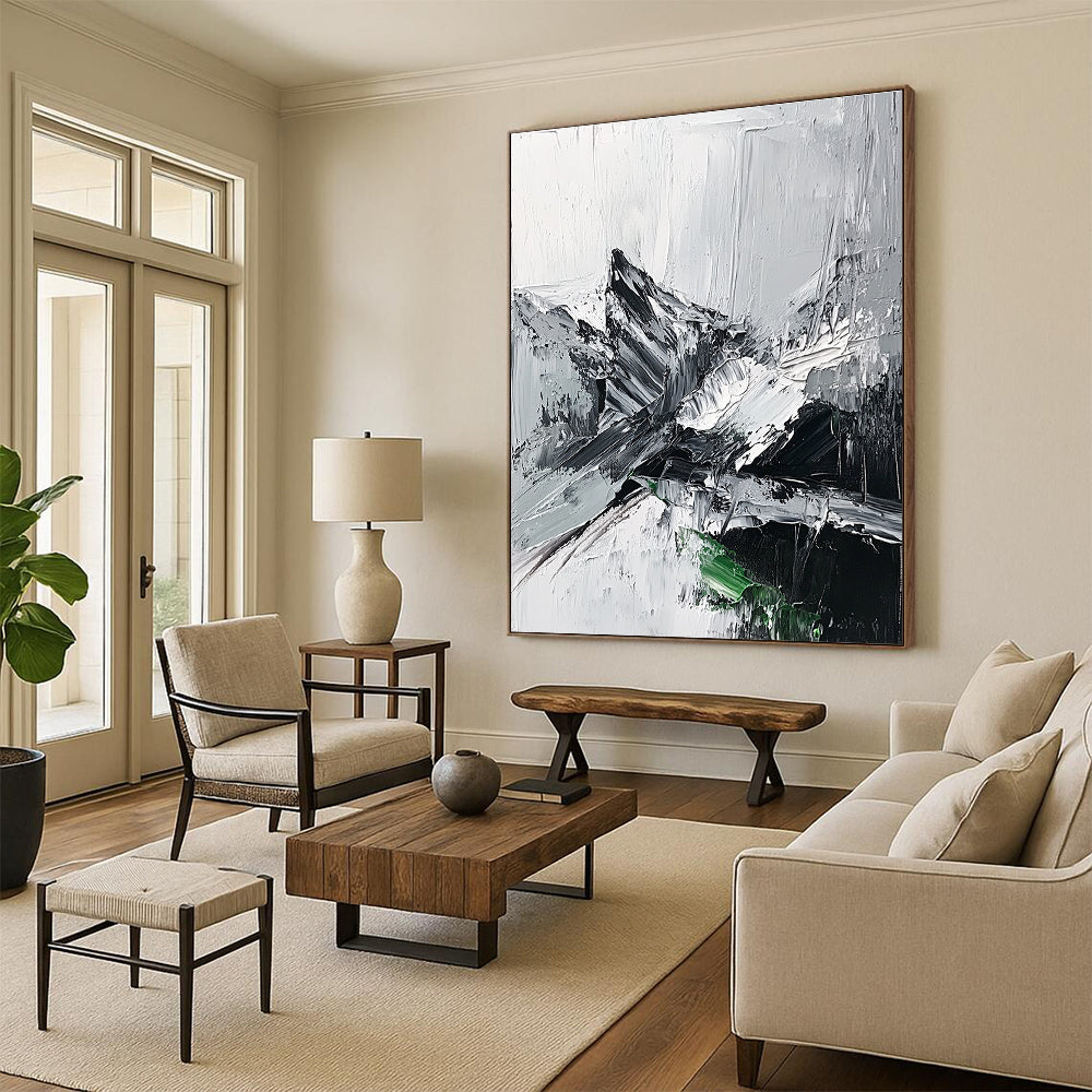 Large abstract painting featuring impasto technique with thick black and white strokes depicting a misty mountain range and a small patch of snow.STSC427