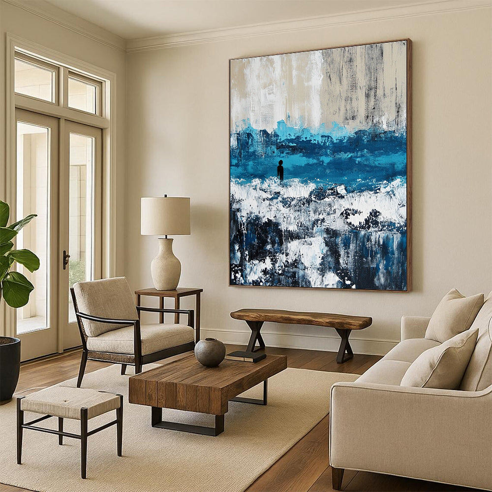 Large abstract painting of an ocean with waves in blue and gray featuring white caps for a serene coastal ambiance.STSC266