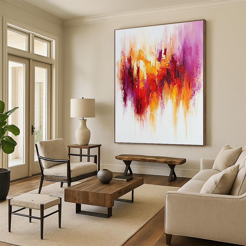 Large abstract painting with textured brush strokes in warm reds and yellows accented by purple on a white background creating a happy uplifting mood.STSC814