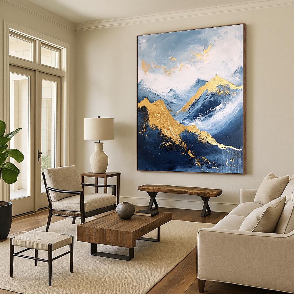 Large abstract painting featuring a golden mountain against a blue sky with white clouds and dark grey stone tones accented with gold.STSC013