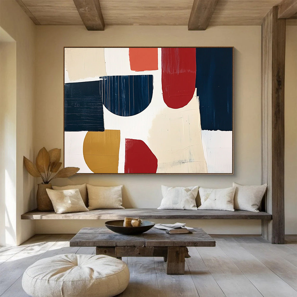 A large abstract painting featuring navy blue cream and red shapes with loose brush strokes on a white background in a collage style.SC489