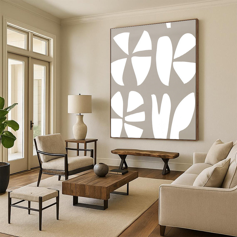 Large abstract painting featuring a white and gray pattern of the number three and two large flowers on a light brown background.STSC1240