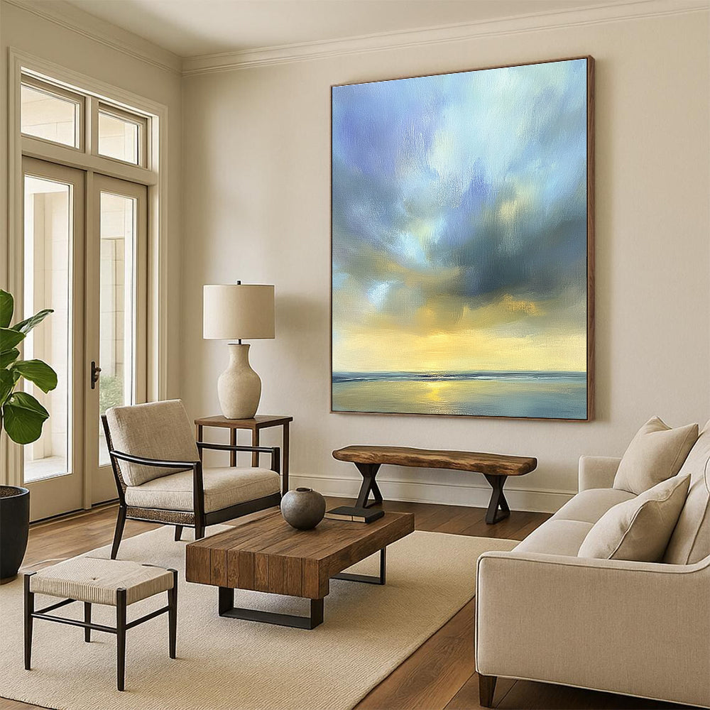 Large abstract oil painting of the sky featuring muted blue light gray and soft clouds over an ocean horizon in beautiful serene colors.STSC201