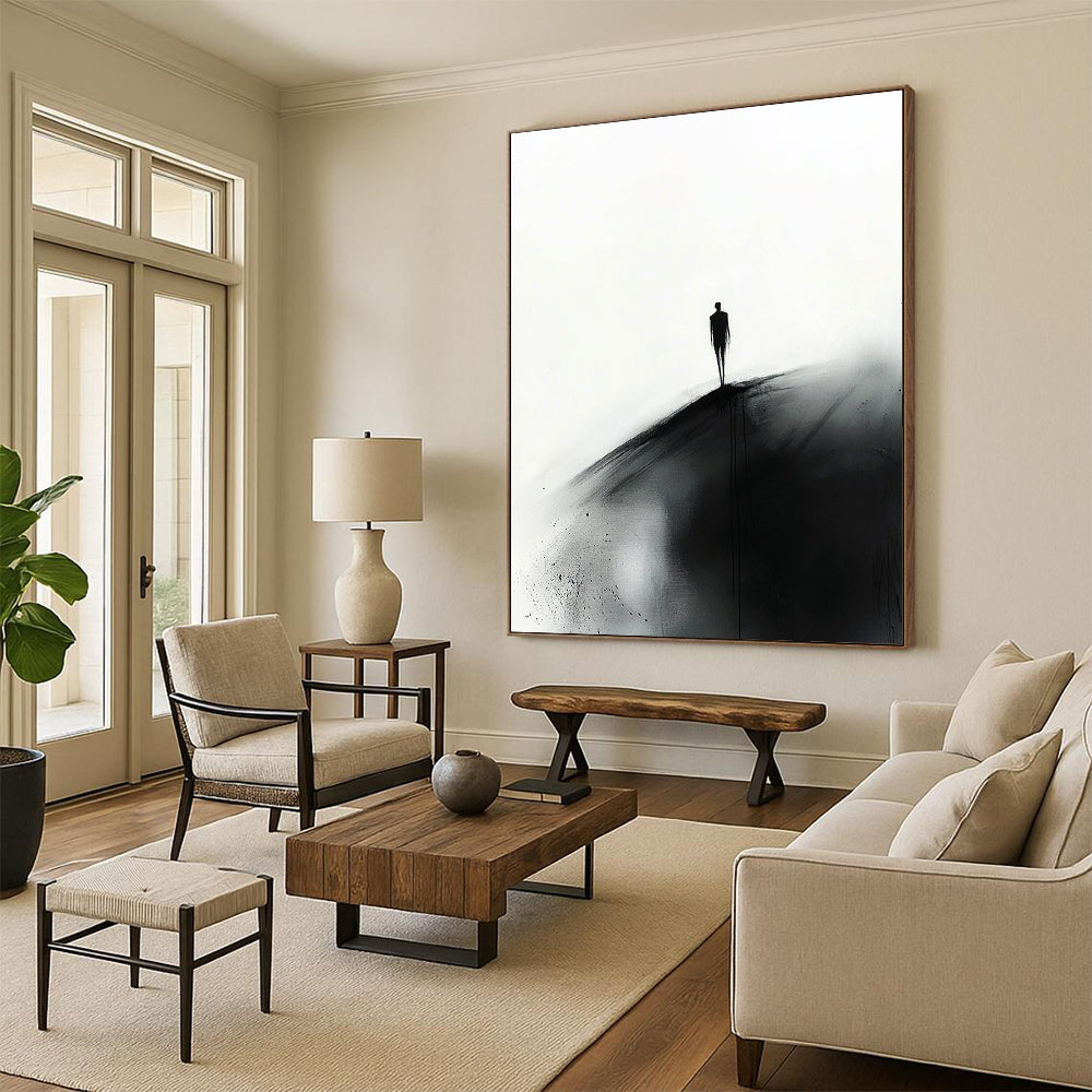 Abstract painting featuring a small silhouette of a man in black walking towards the viewer on a hill against a white ink wash background.STSC1349