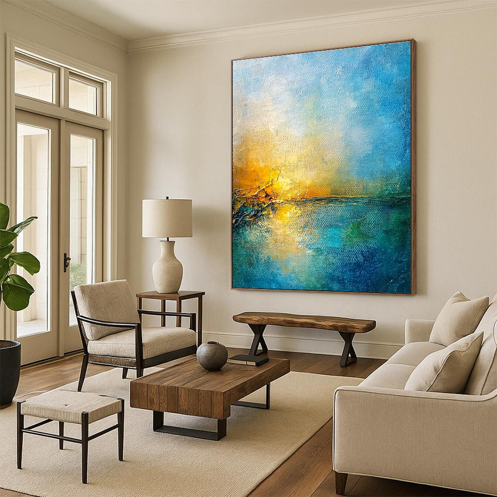 Large abstract painting of a golden sunset over a blue sea featuring textured canvas and rustic-core style nature-inspired colors.STSC165